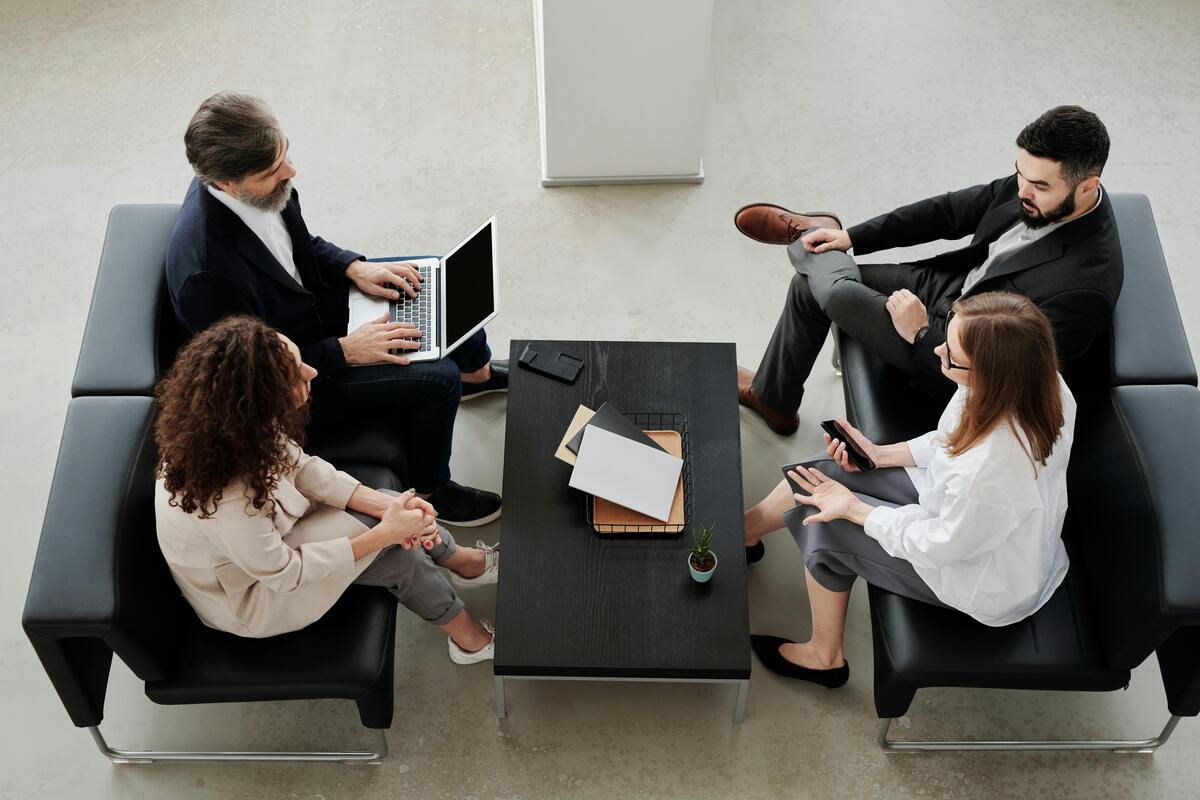 Small law firm team meeting with virtual legal assistant support for client communication and case workflow