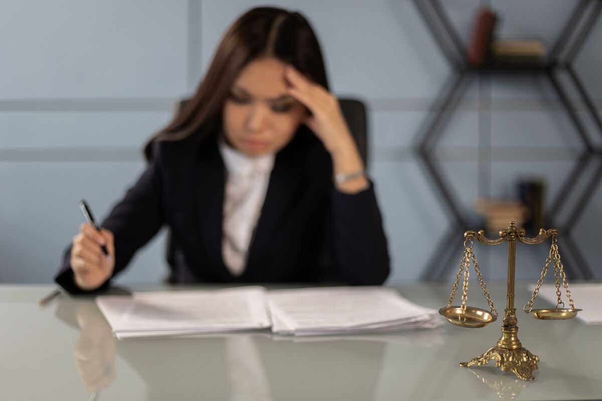 Solo attorney reviewing legal documents with virtual legal assistant support for daily law firm tasks